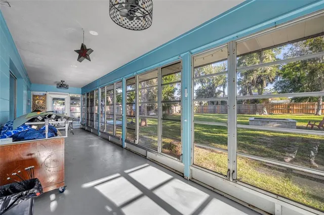 a view of living room with furniture and floor to ceiling windows