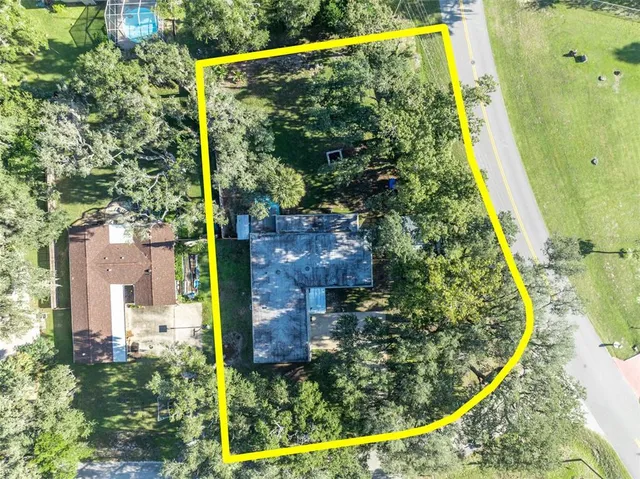 an aerial view of a house with swimming pool