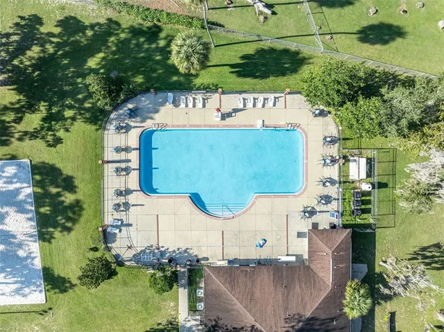 an aerial view of a house with outdoor space