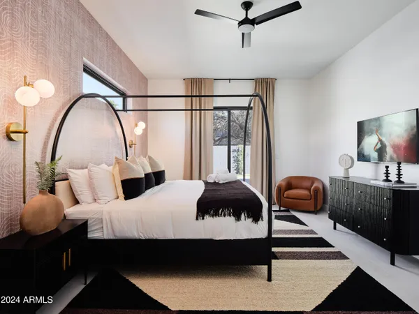 a bedroom with a bed and window