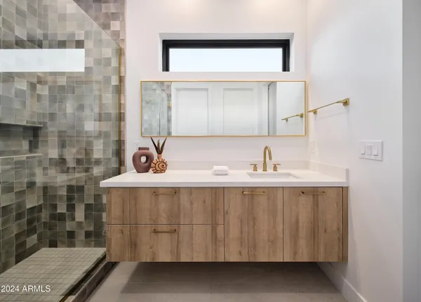 a bathroom with a sink and a mirror