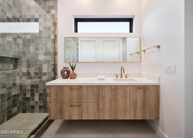 a bathroom with a sink and a mirror