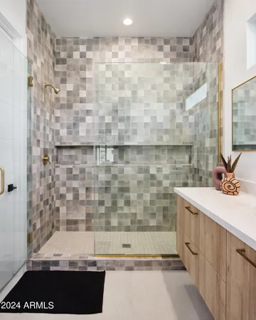 a bathroom with a bathtub and shower