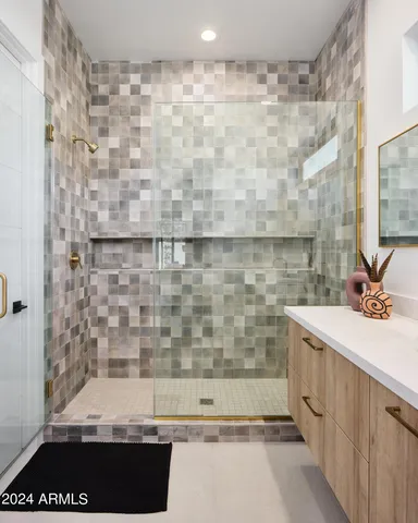 a bathroom with a bathtub and shower
