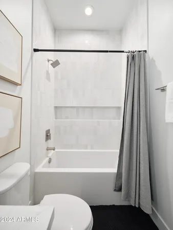 a bathroom with a toilet a sink and a bathtub