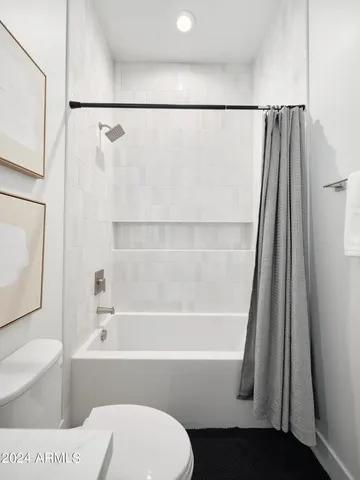 a bathroom with a toilet a sink and a bathtub