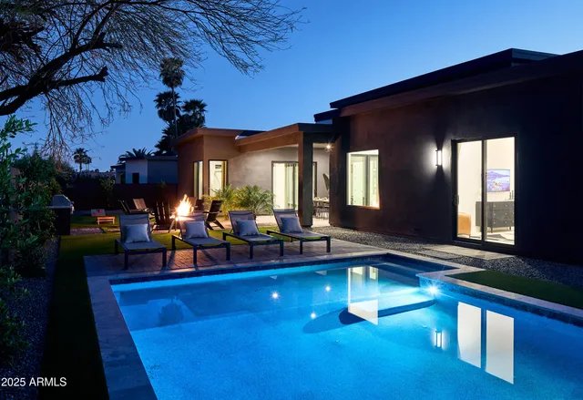 a living room with lots of furniture and swimming pool