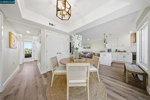 a kitchen with granite countertop a sink stainless steel appliances and cabinets