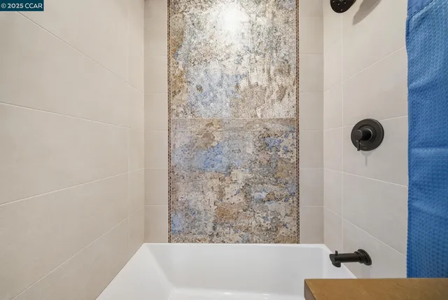 a outdoor space with lots of tables a large window and chairs