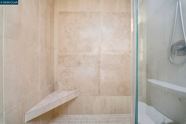 a view of a swimming pool and trees in a yard