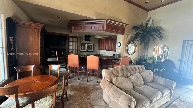 a living room with furniture and a clock