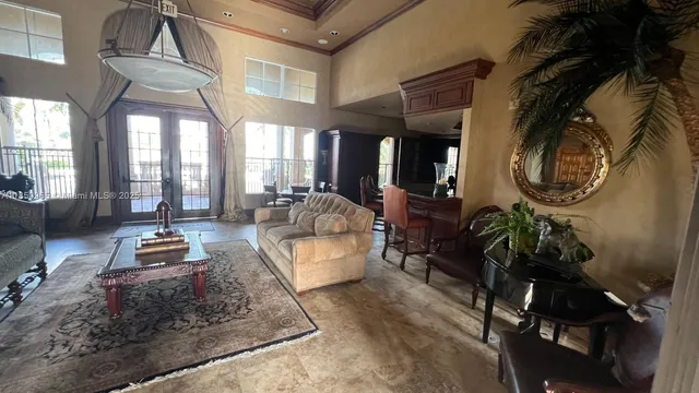 a living room with furniture and a mirror