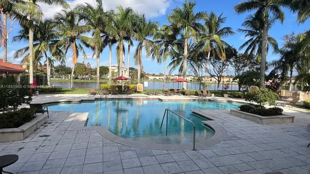 a view of swimming pool with outdoor seating