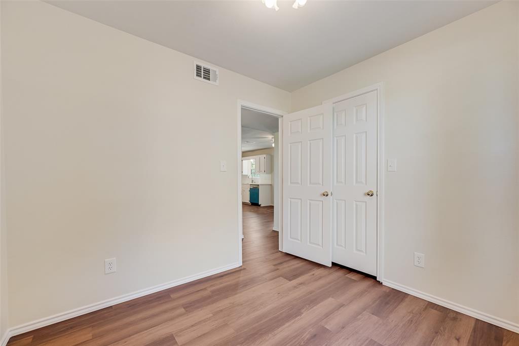 751 County Road 1240 Mount Pleasant, TX 75455 - Photo 27 of 35 a view of an empty room with wooden floor