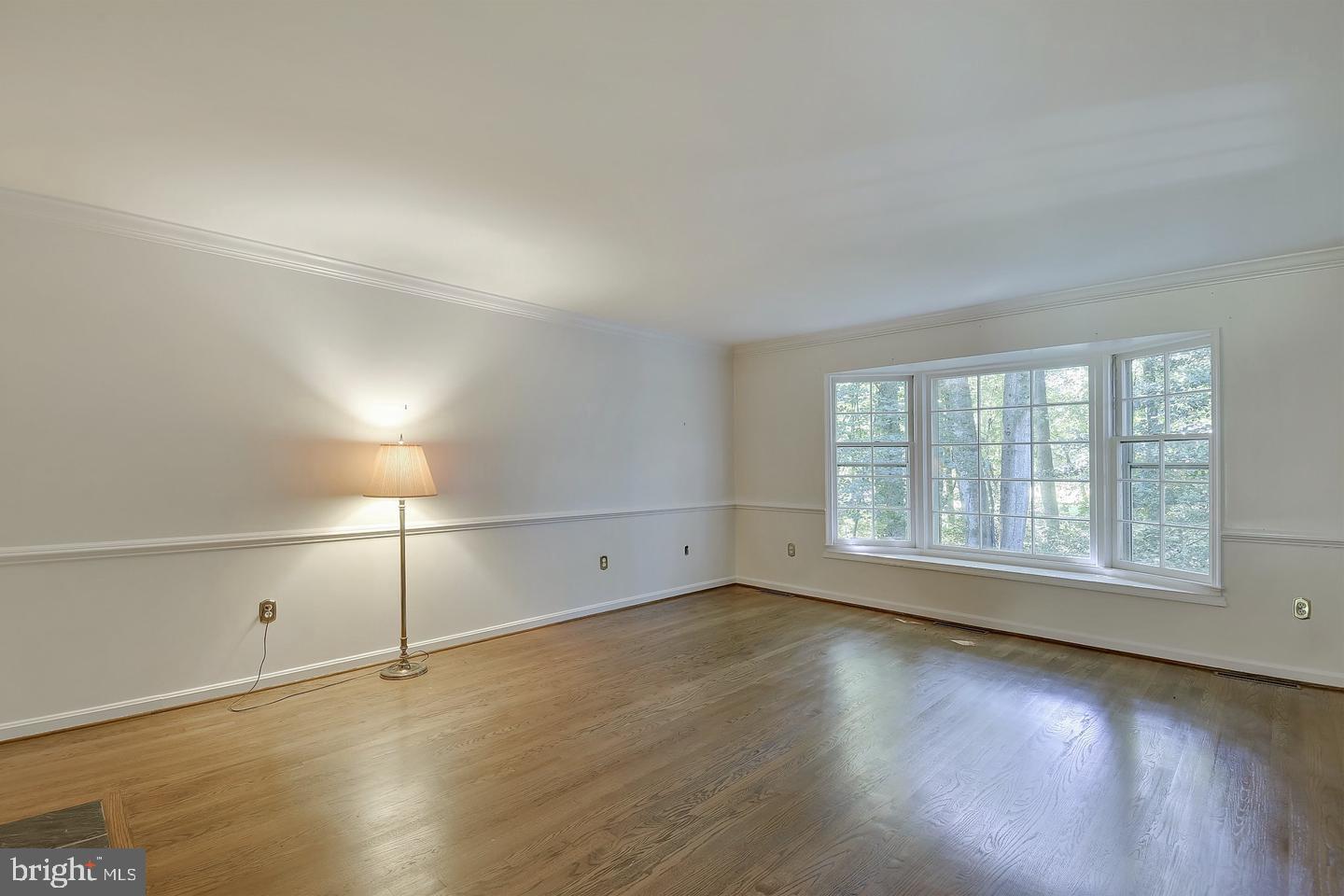 2025 Post Road Vienna, VA 22181 - Photo 9 of 24 Living Room with Wood Floors and Bay Windows