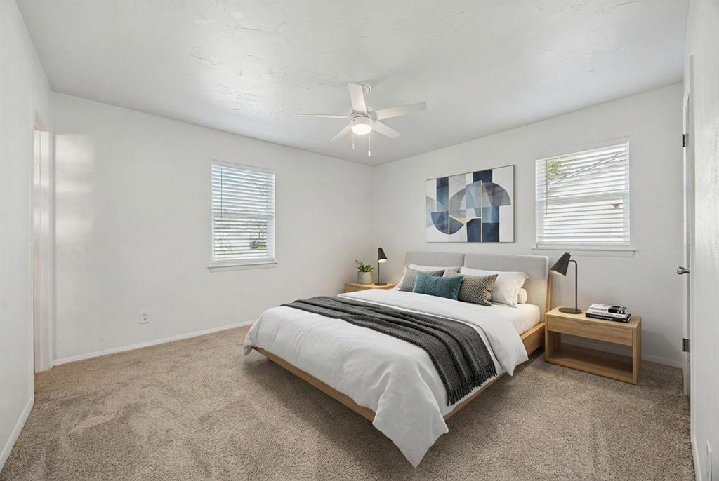 312 East Hampton Road Crowley, TX 76036 - Photo 12 of 22 a bedroom with a large bed and a window