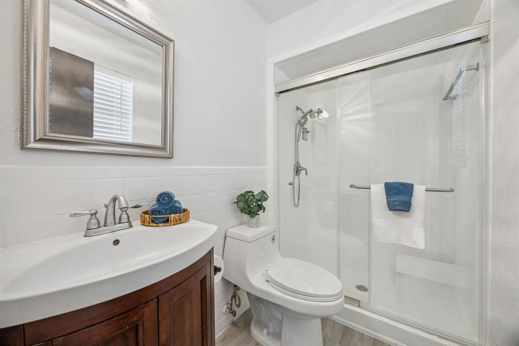 312 East Hampton Road Crowley, TX 76036 - Photo 13 of 22 a bathroom with a sink toilet and shower
