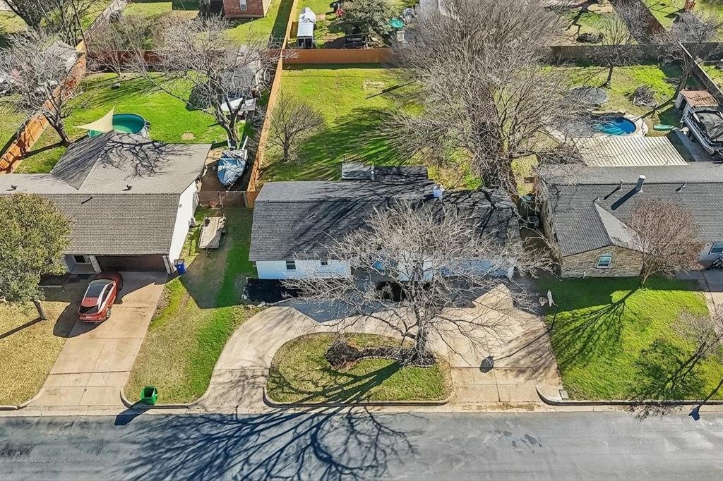 312 East Hampton Road Crowley, TX 76036 - Photo 22 of 22 an aerial view of a house with garden space and sitting area