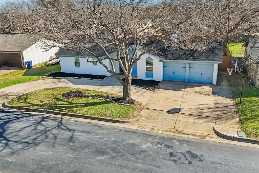 312 East Hampton Road Crowley, TX 76036 - Photo 4 of 22 a view of a house with snow on the road