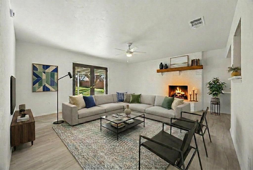 312 East Hampton Road Crowley, TX 76036 - Photo 7 of 22 a living room with furniture and wooden floor