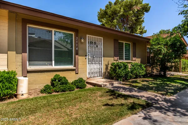 front view of a house with a yard