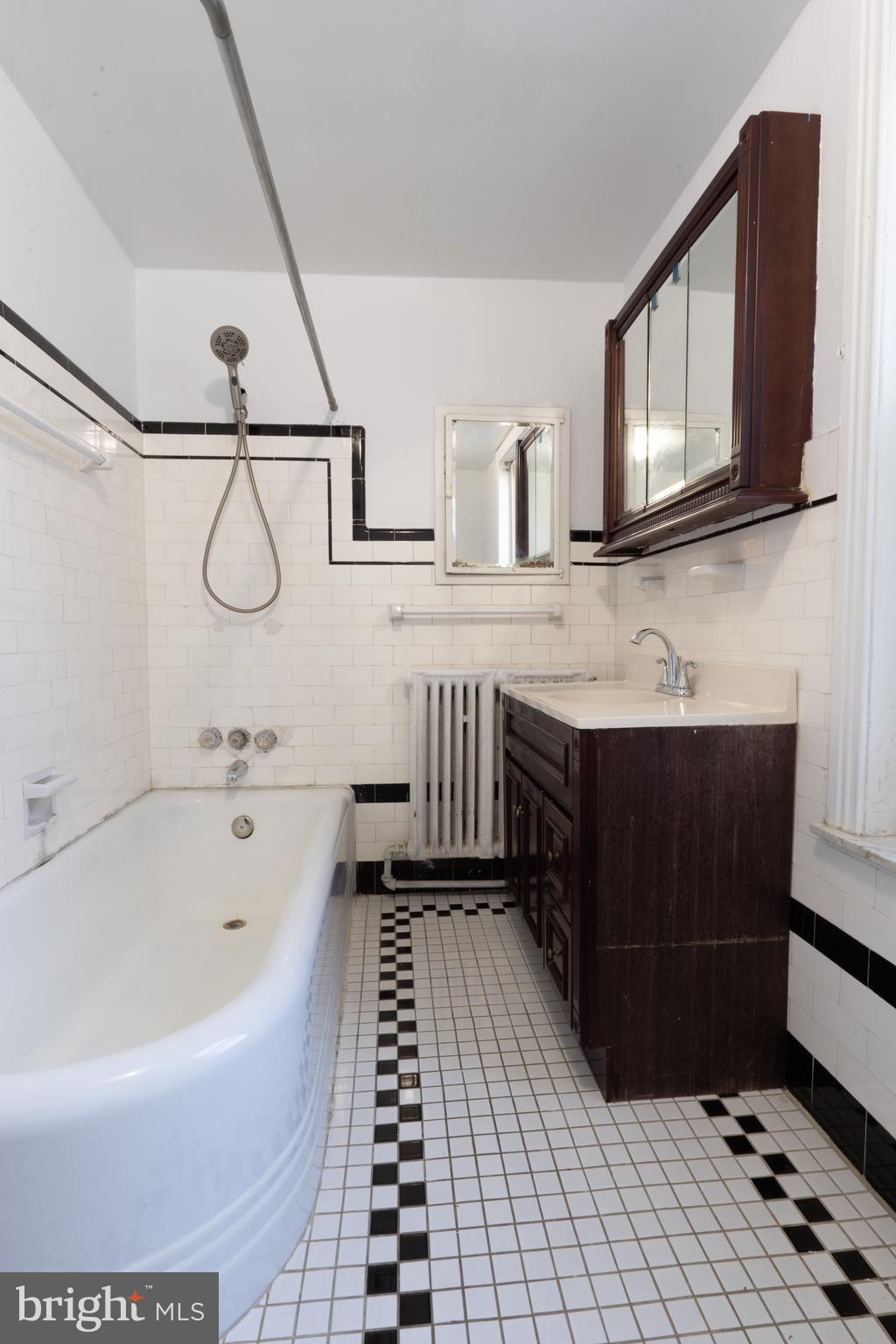 3618 Emerald Street Philadelphia, PA 19134 - Photo 11 of 34 a bathroom with a bathtub and a sink