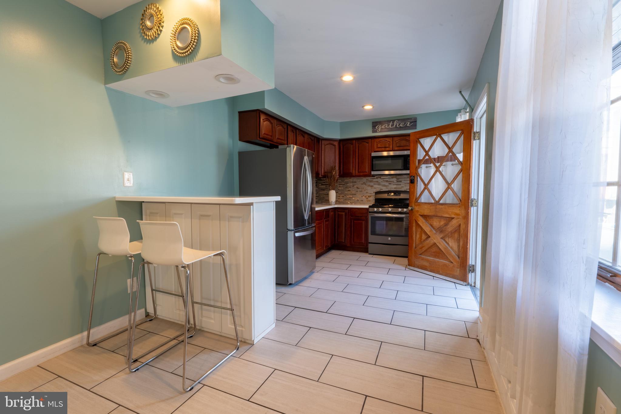 3618 Emerald Street Philadelphia, PA 19134 - Photo 25 of 34 a view of kitchen with furniture and electronic appliances