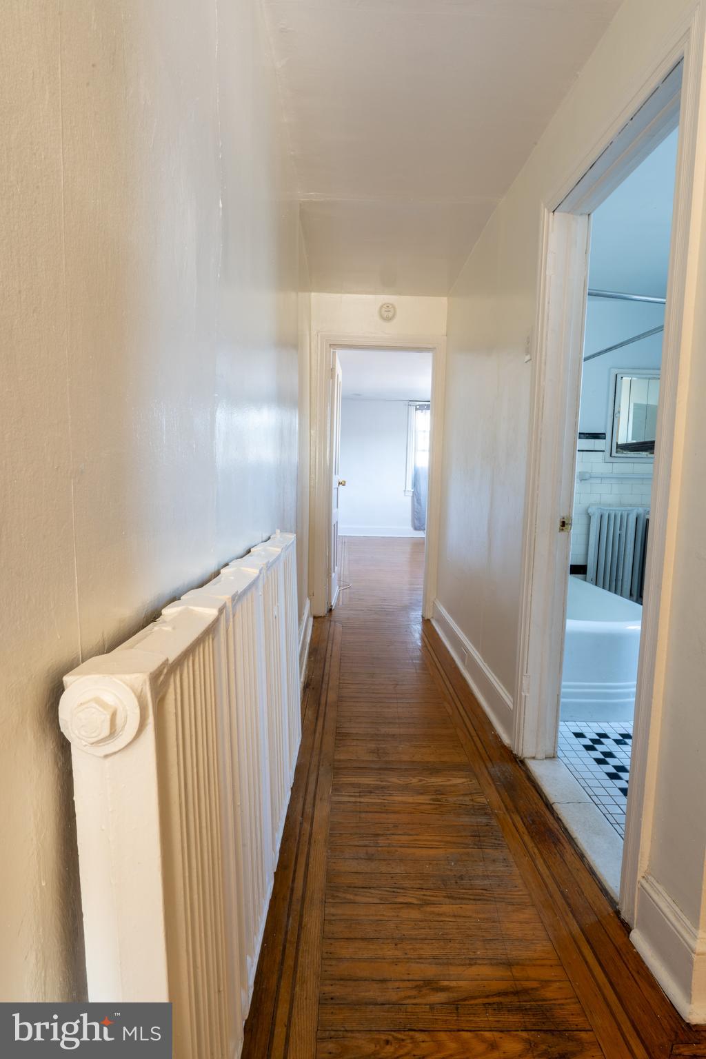 3618 Emerald Street Philadelphia, PA 19134 - Photo 6 of 34 a view of a hallway with wooden floor