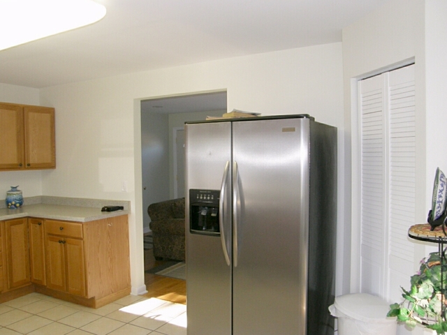 130 Bay Road Fox Lake, IL 60020 - Photo 13 of 21 a kitchen with a refrigerator and a sink