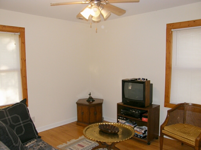 130 Bay Road Fox Lake, IL 60020 - Photo 18 of 21 a living room with furniture and a flat screen tv