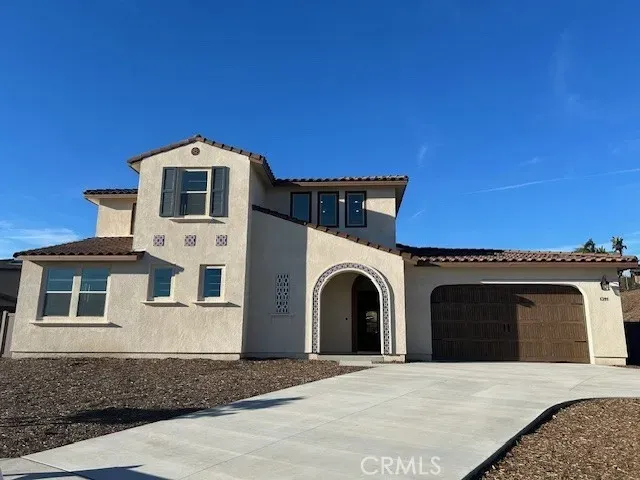 a front view of a house with a garage