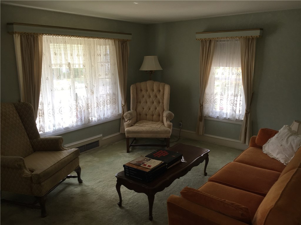 34 Ruth Street Pawtucket, RI 02861 - Photo 19 of 25 Living room with wall to wall carpeting. Hardwood floors under carpeting
