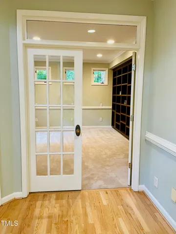 a view of an empty room with a window and a room