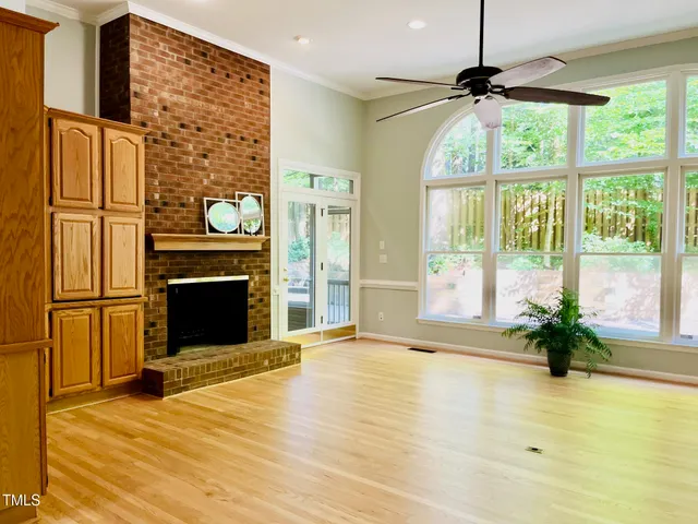 a view of a livingroom with a fireplace and furniture