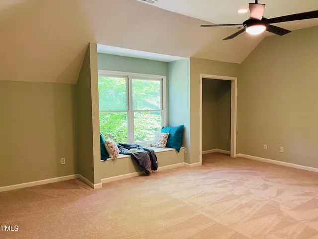 a room with a window and flowerpot