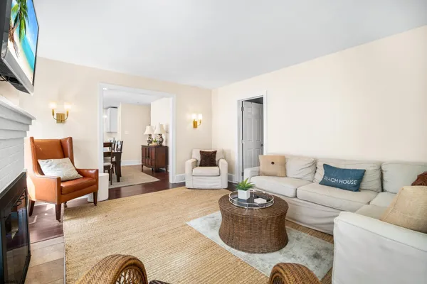 a living room with furniture or couch and a flat screen tv