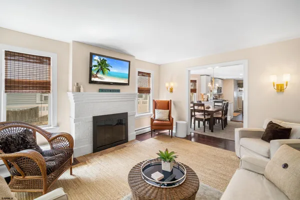 a living room with furniture and a fireplace