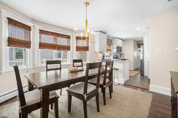 a dining room with furniture and window