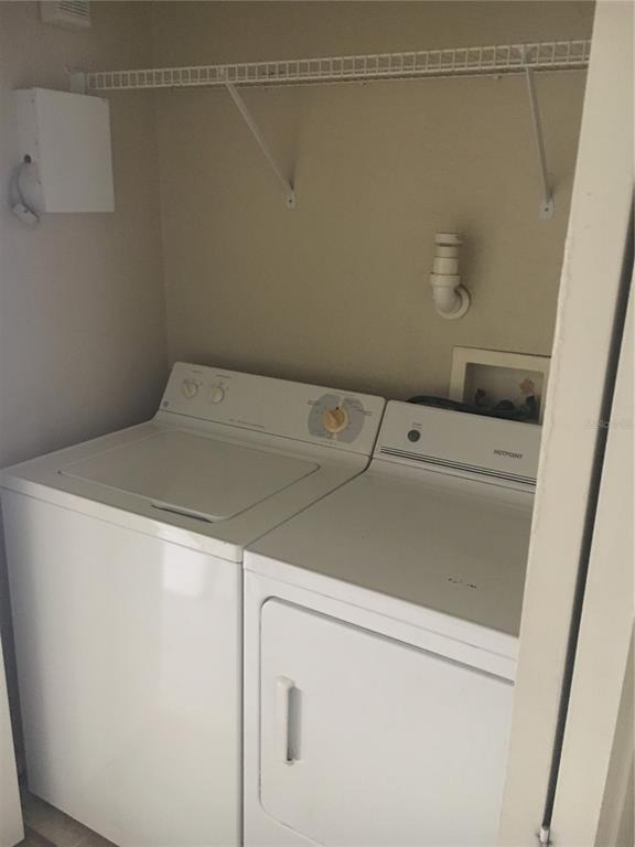 3355 South Kirkman Road, Unit 1324 Orlando, FL 32811 - Photo 12 of 19 a utility room with dryer and washer