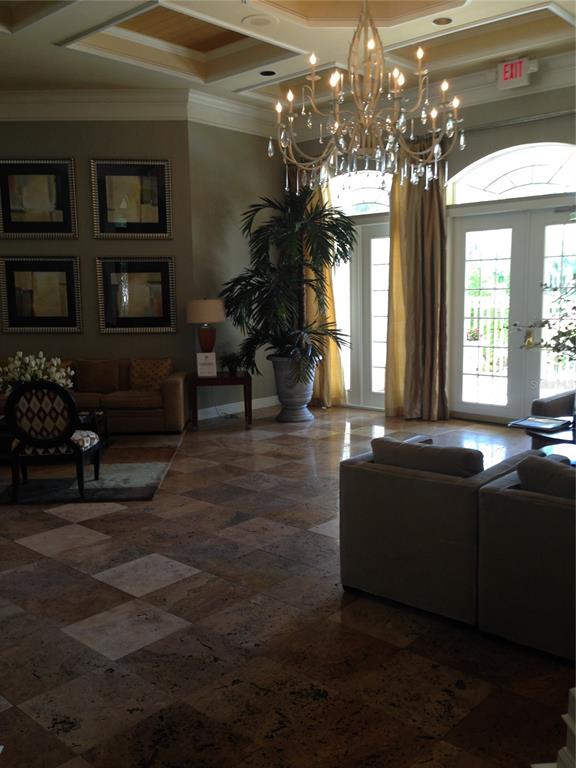 3355 South Kirkman Road, Unit 1324 Orlando, FL 32811 - Photo 15 of 19 a lobby with furniture and chandelier