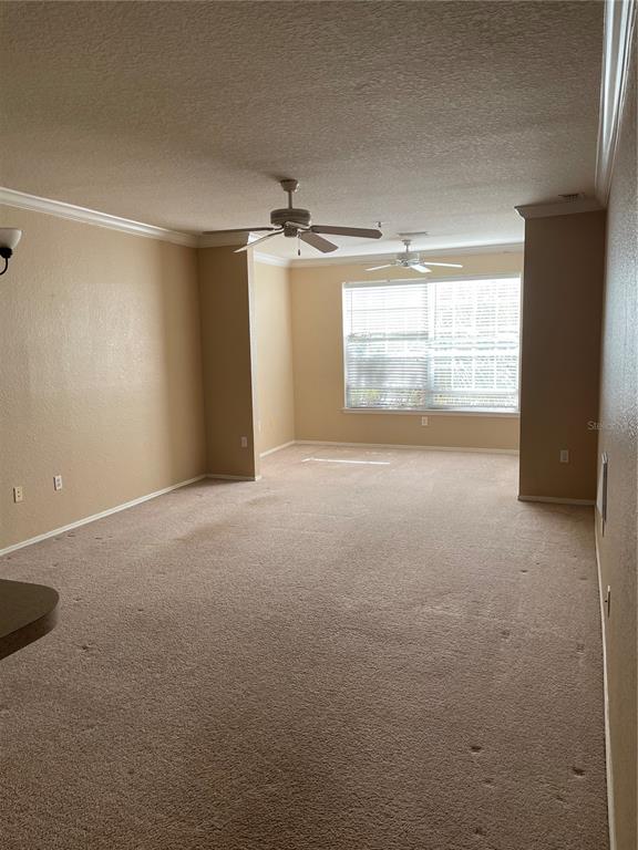3355 South Kirkman Road, Unit 1324 Orlando, FL 32811 - Photo 2 of 19 a view of an empty room with a window