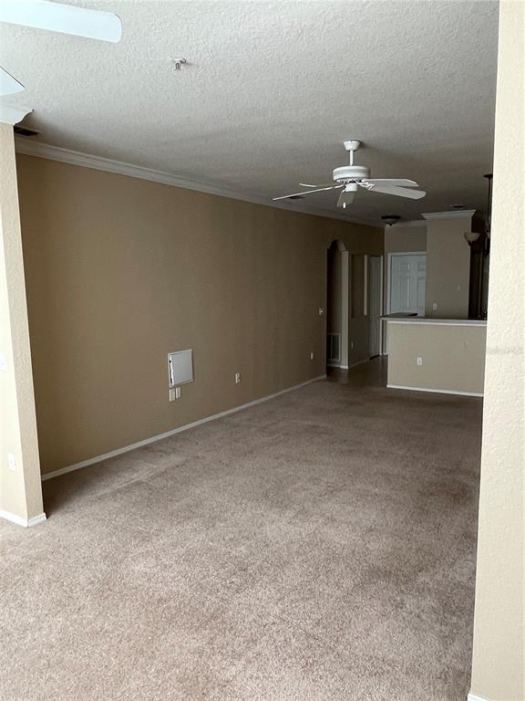 3355 South Kirkman Road, Unit 1324 Orlando, FL 32811 - Photo 4 of 19 a view of an empty room with a chandelier