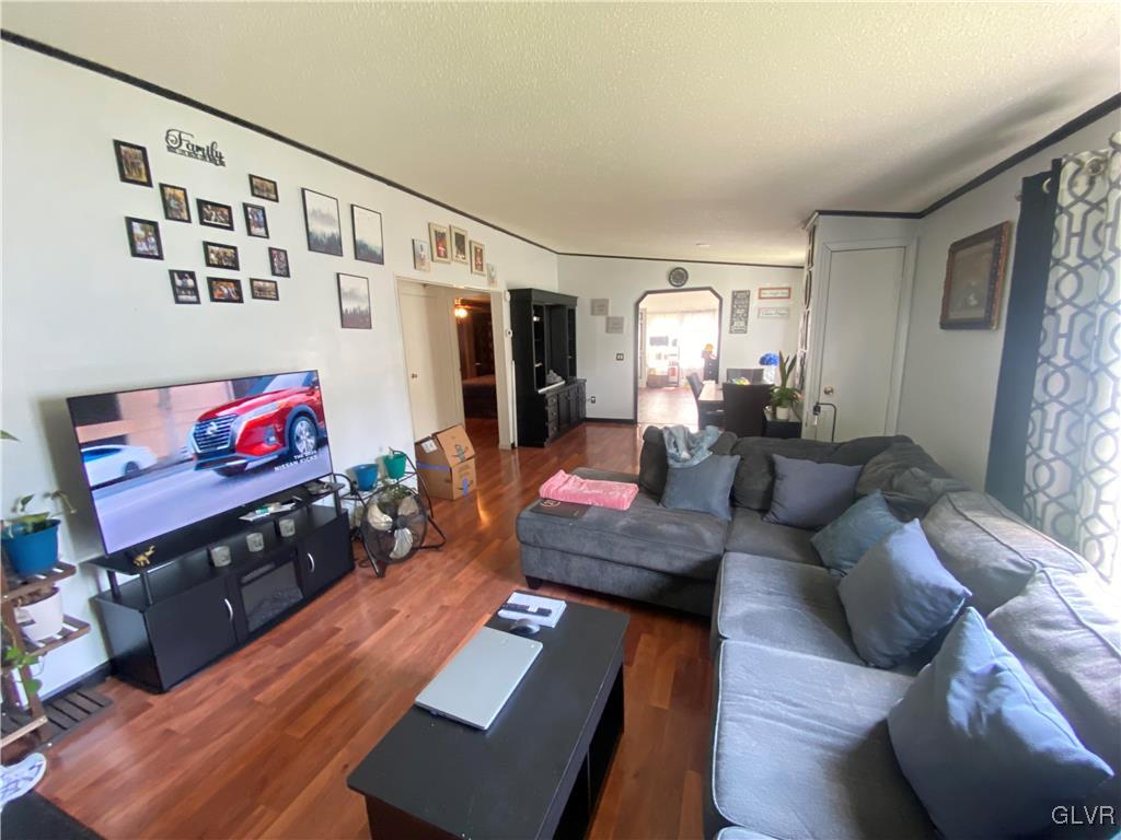 124 Greenbriar Drive North Bath, PA 18014 - Photo 2 of 10 a living room with furniture and a flat screen tv