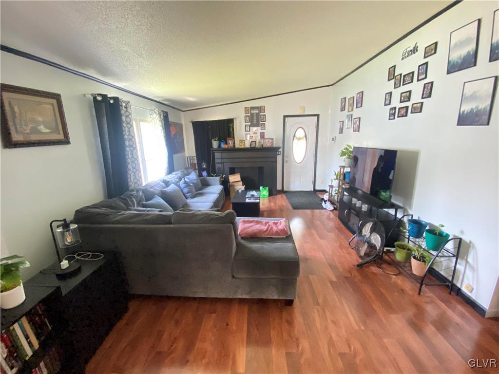 124 Greenbriar Drive North Bath, PA 18014 - Photo 4 of 10 a living room with furniture and a flat screen tv