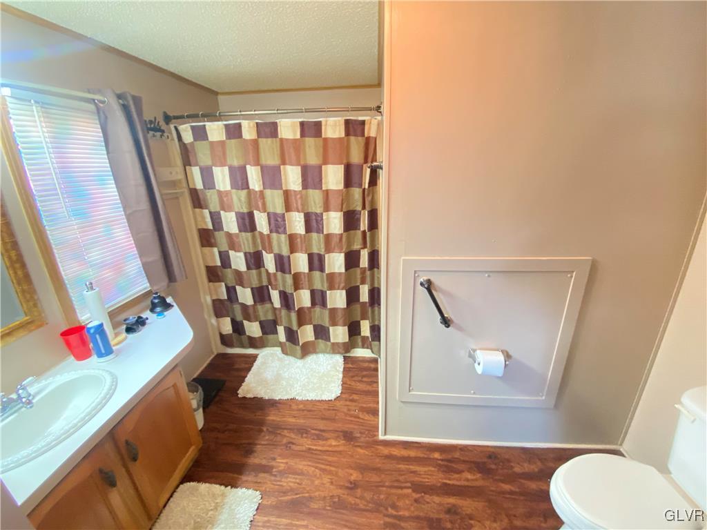 124 Greenbriar Drive North Bath, PA 18014 - Photo 5 of 10 a bathroom with a sink toilet and shower