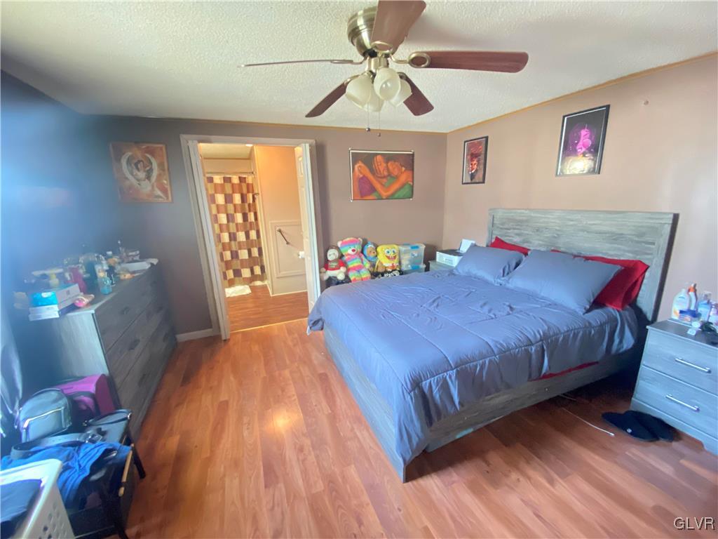 124 Greenbriar Drive North Bath, PA 18014 - Photo 9 of 10 a bedroom with a bed and wooden floor