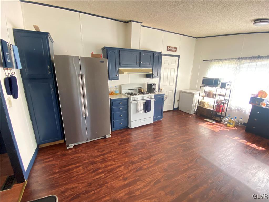 124 Greenbriar Drive North Bath, PA 18014 - Photo 10 of 10 a kitchen with stainless steel appliances a refrigerator and wooden floor
