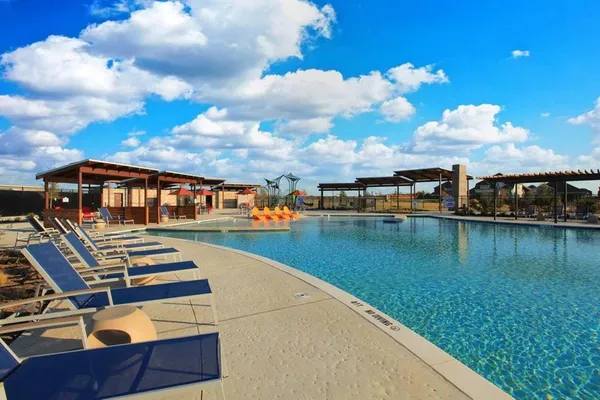 a view of swimming pool with outdoor seating