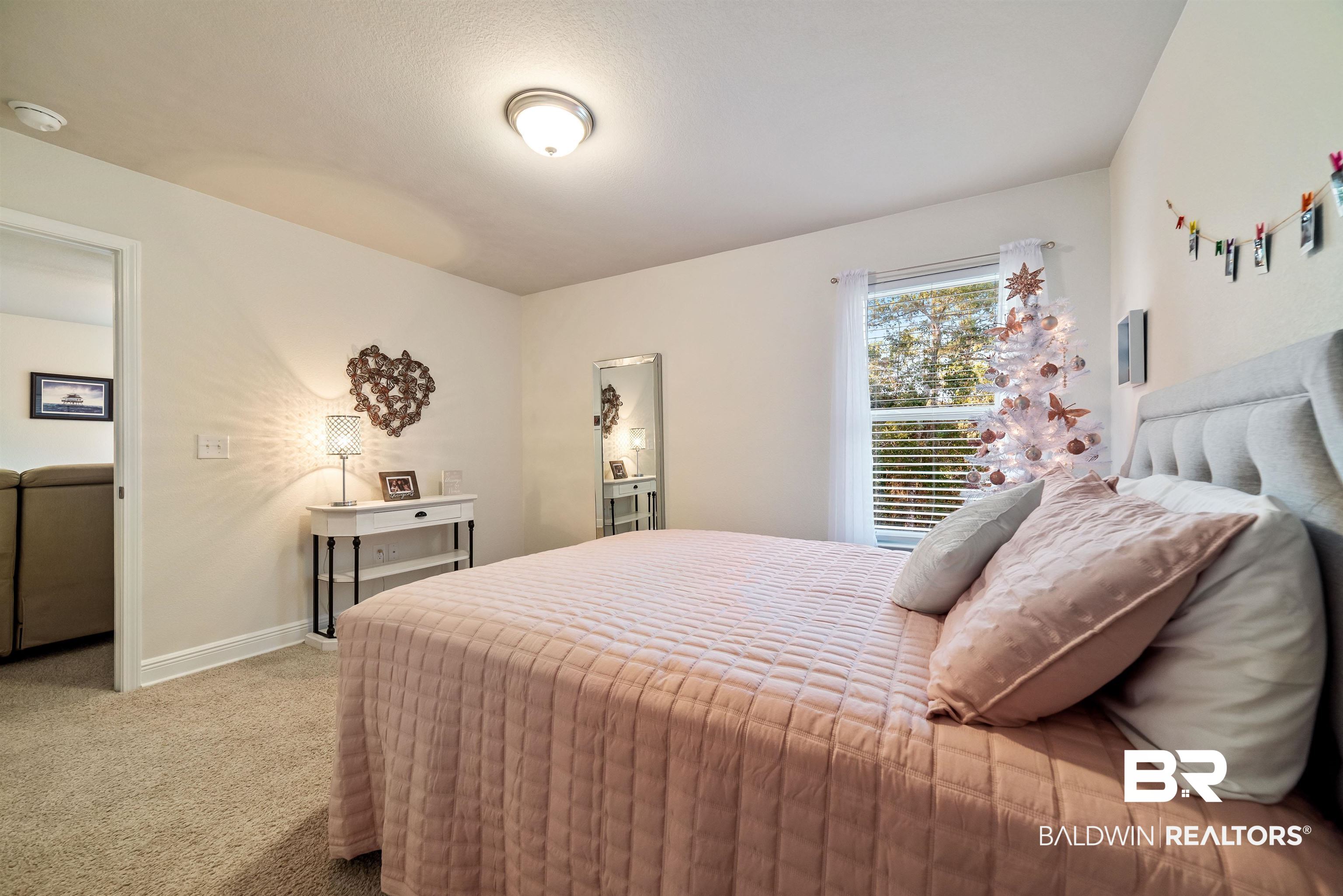 1290 Mako Loop Gulf Shores, AL 36542 - Photo 26 of 50 Carpeted bedroom with baseboards