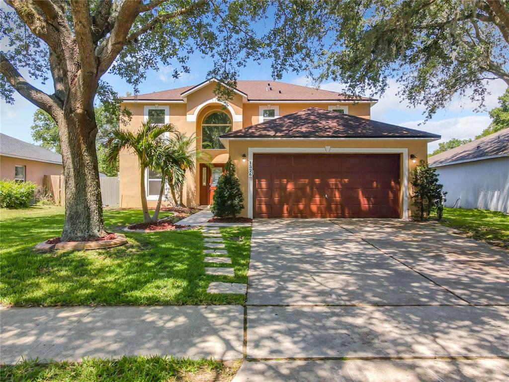 1326 Welch Ridge Terrace Apopka, FL 32712 - Photo 1 of 1 a front view of a house with garden